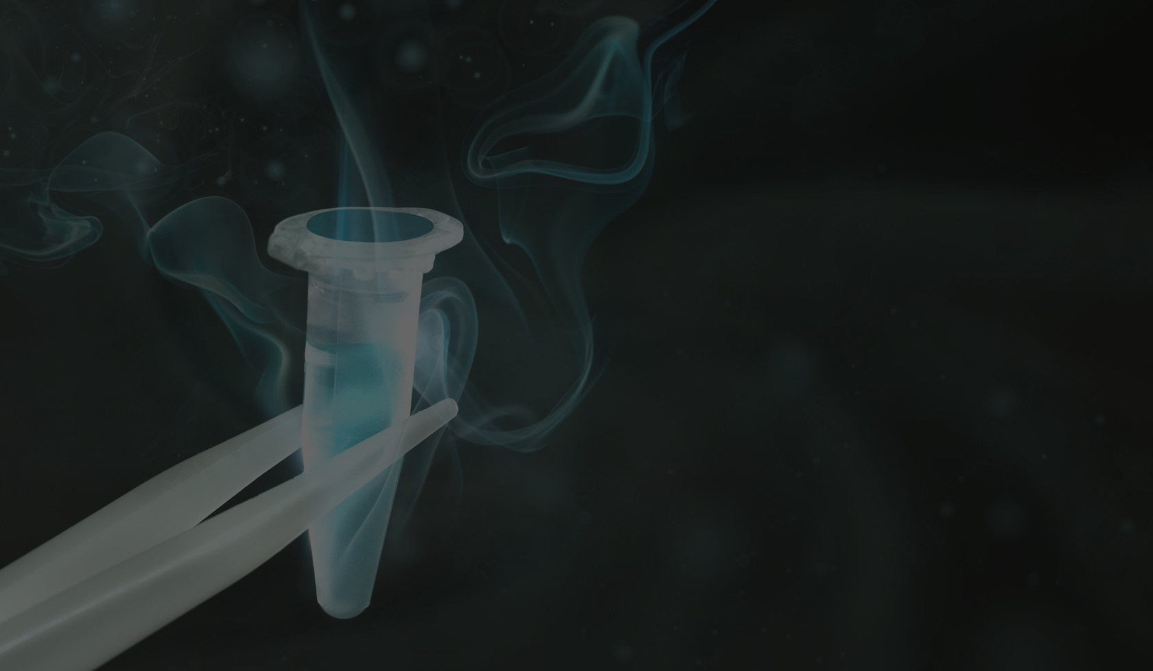 A cryogenic sample vial held with tweezers as cold teal vapour rises around it.